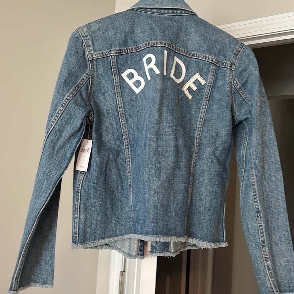 Women’s blue denim GAP jacket with “BRIDE” spelled on the back. Size S. NWT